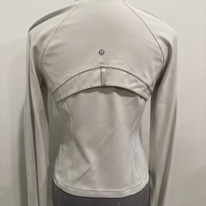 Lululemon Athletica Cropped Define Jacket in a neutral bone color, size 10.